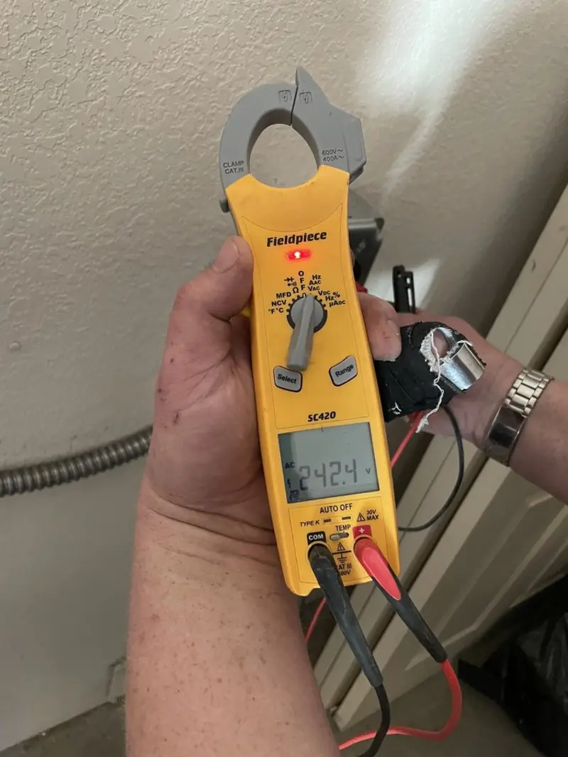 Voltage testing with clamp meter during Ceiling Fan Installation in Lake Helen